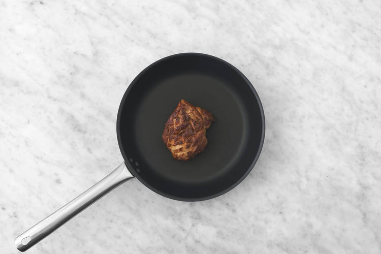 Cook the plant-based crumbed chicken