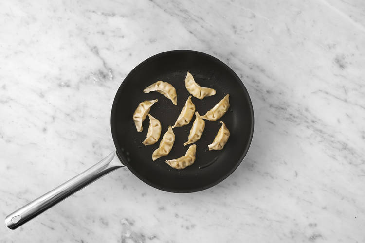 Cook the veggie gyozas & chicken