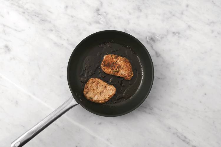 Cook the pork steaks & prawns