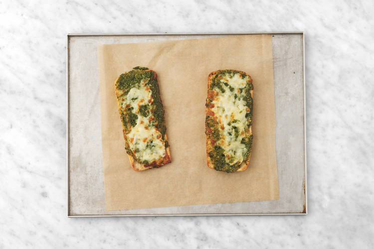 Make the cheesy pesto toasts