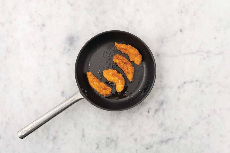 Cook the crumbed chicken