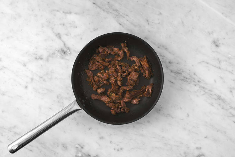 Cuire la carne asada