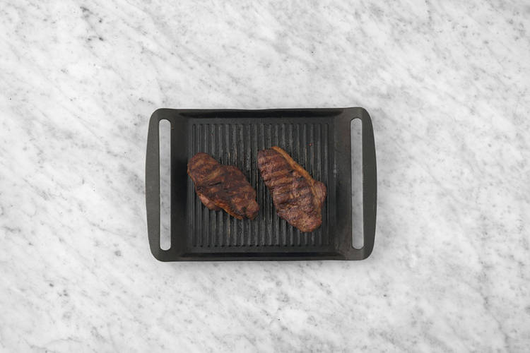 Grill the porterhouse steak