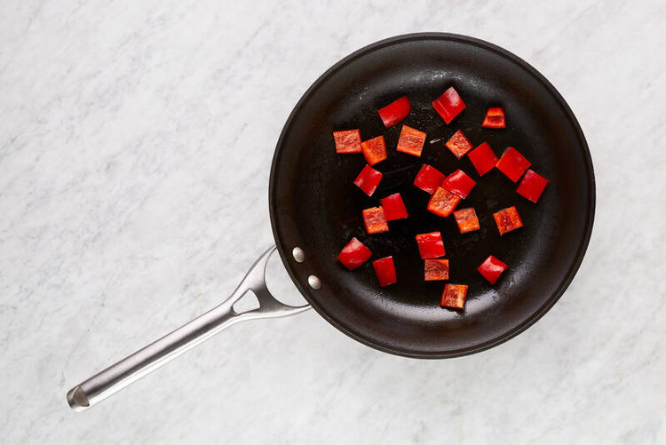 Cook sausage and peppers