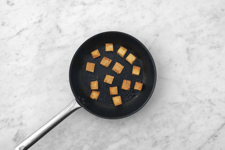 Cook chicken and prep and fry tofu