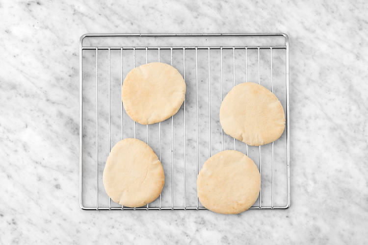 Heat the pita & toss the salad