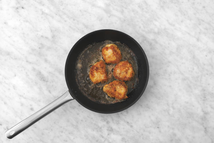 Fry the crumbed pork