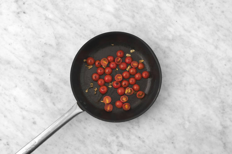 Blister the tomatoes