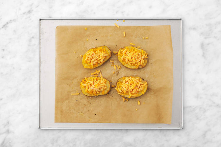 Melt cheese on potatoes