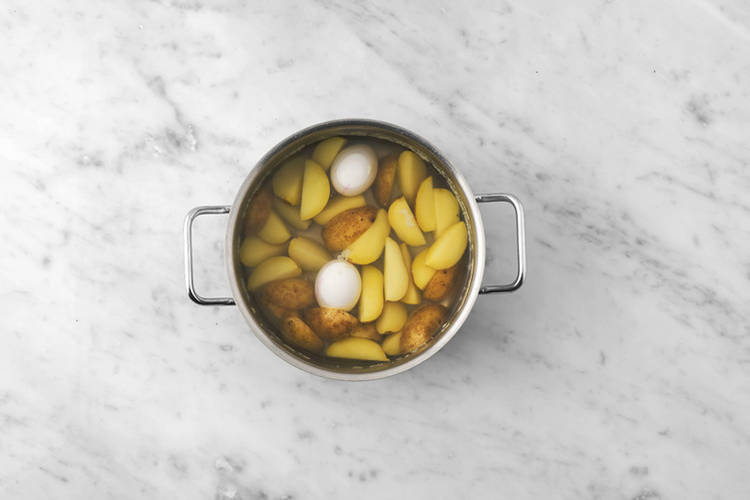 Cook the potatoes & eggs