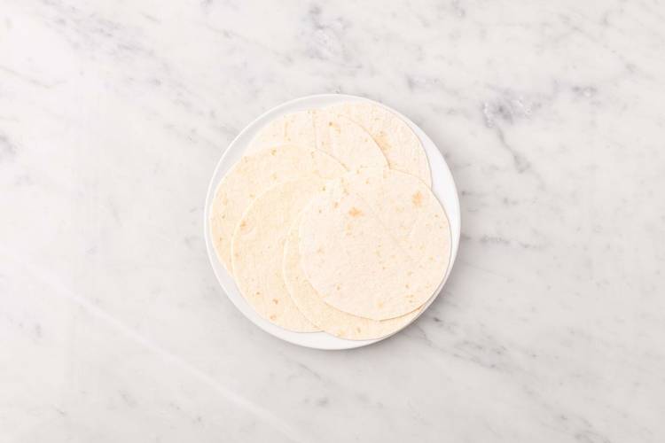 Warm tortillas and make sauce