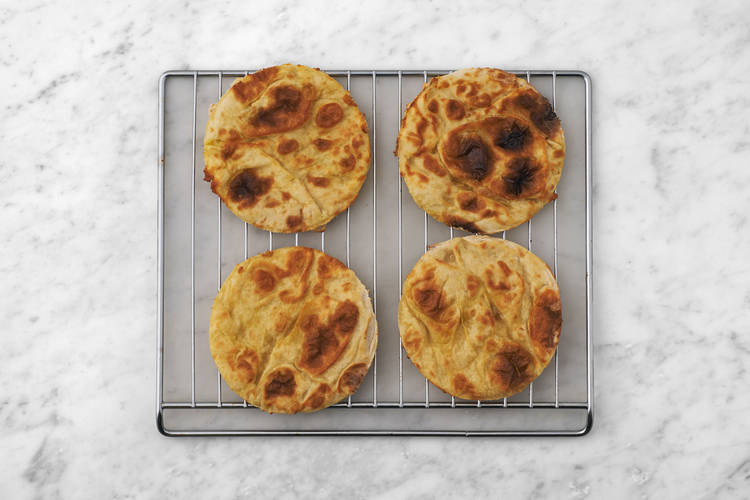 Heat the flatbreads & make the garlic yoghurt