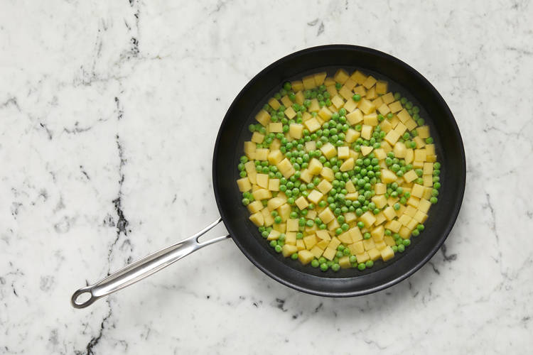 Cook potatoes and peas