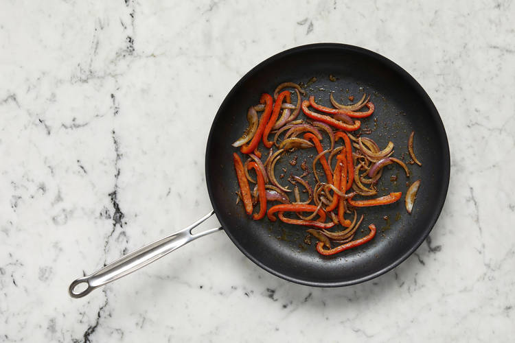 Toast almonds and cook veggies