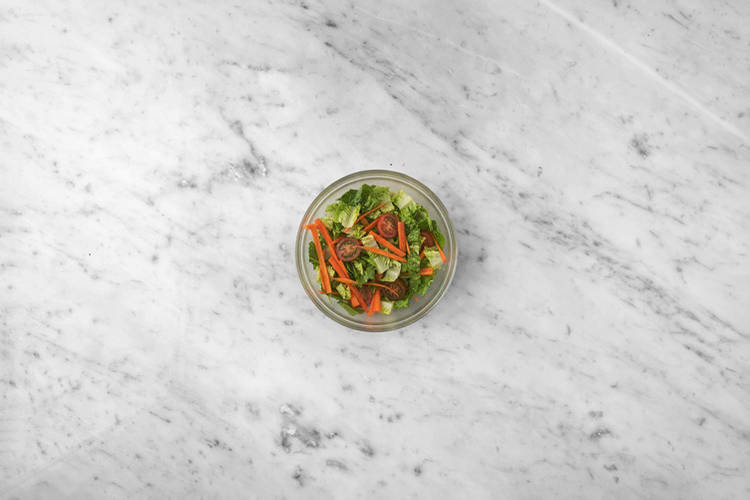 Dress the salad & warm the pita bread