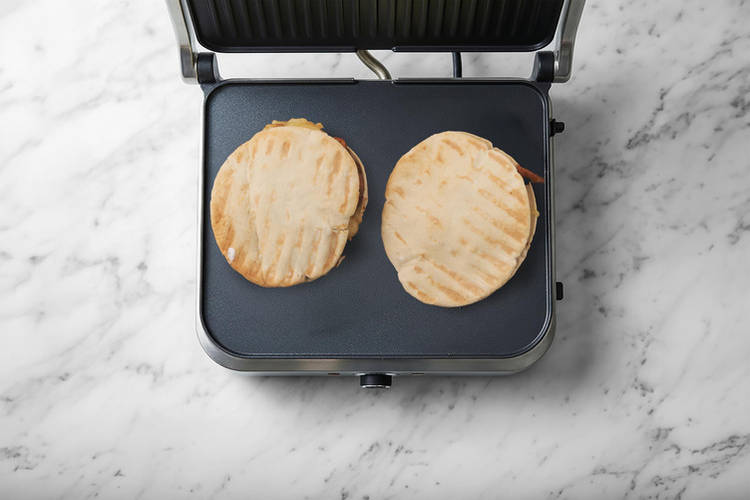 Toast the pita pockets & toss the salad