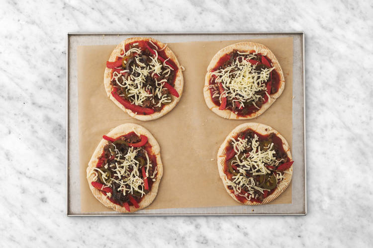 Assemble the pizzas