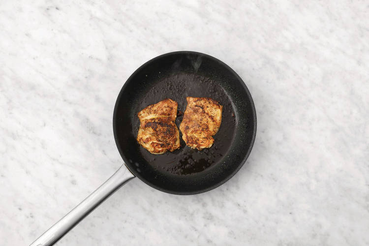 Cook the plant-based crumbed chicken