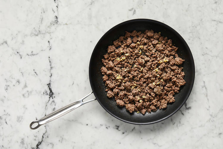 Cook veggies and Beyond Meat® 