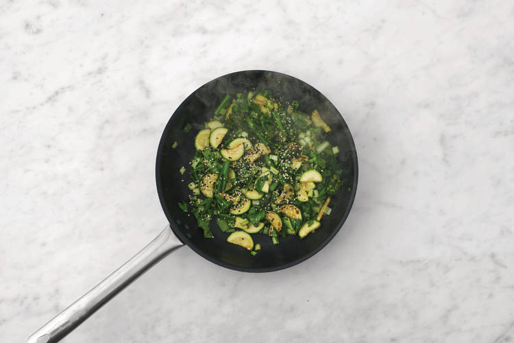 Stir-fry the greens