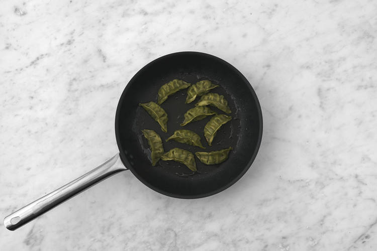 Cook the gyozas