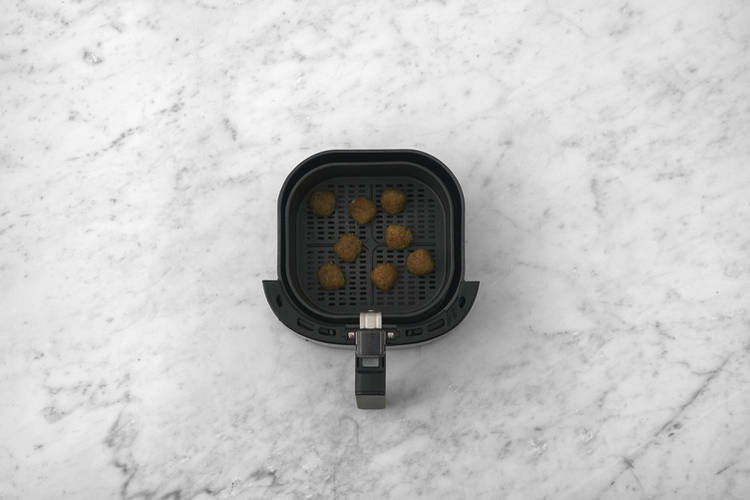 Heat the falafel & cook the chicken