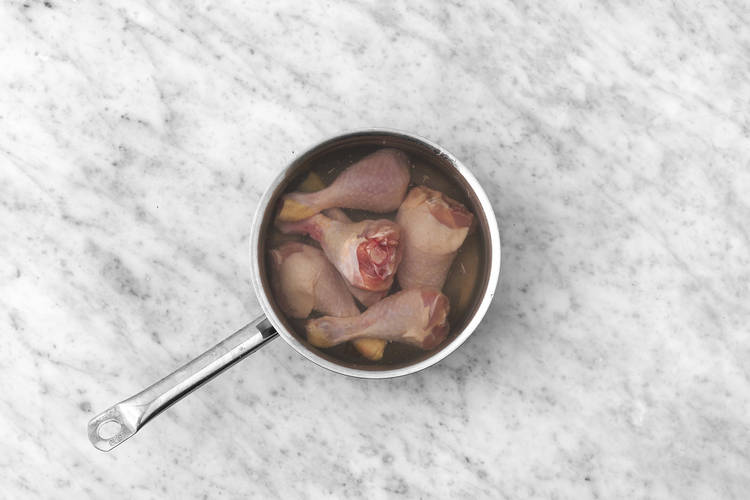 Poach the drumsticks