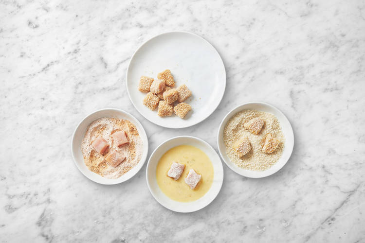 Crumb the prawns