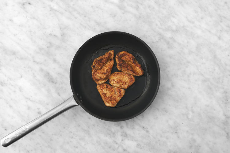 Cook the plant-based crumbed chicken