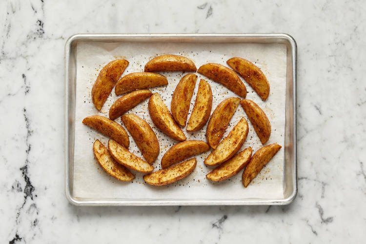 Prep potatoes and roast wedges