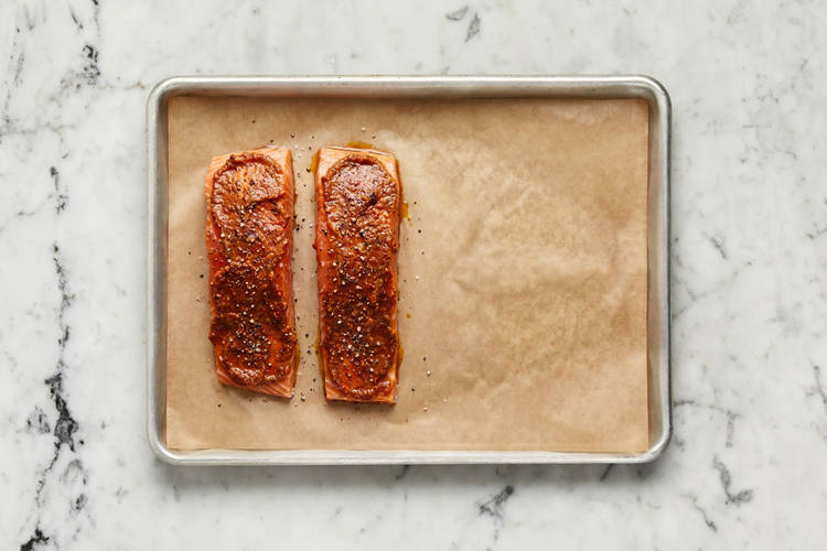 Season and par-cook salmon