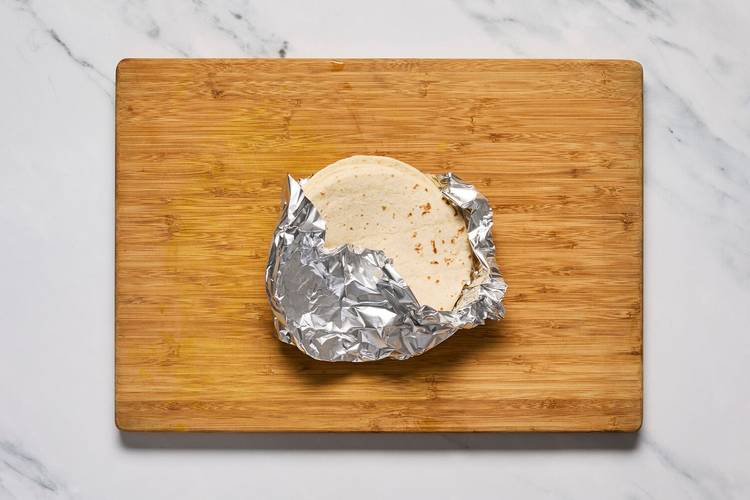 Warm tortillas and finish prep