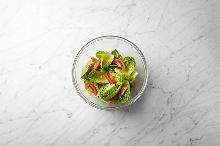 Heat the pitas & toss the salad 