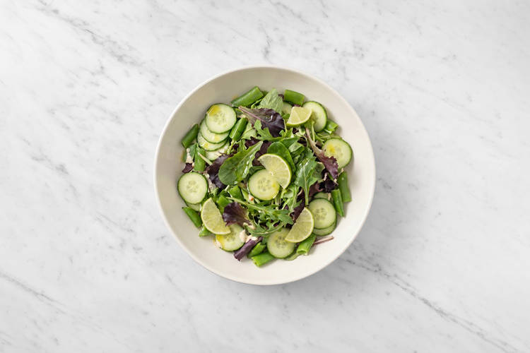 Heat the bao buns & toss the salad