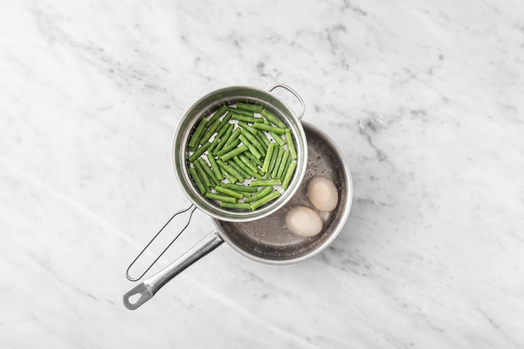 Steam the green beans & boil the eggs