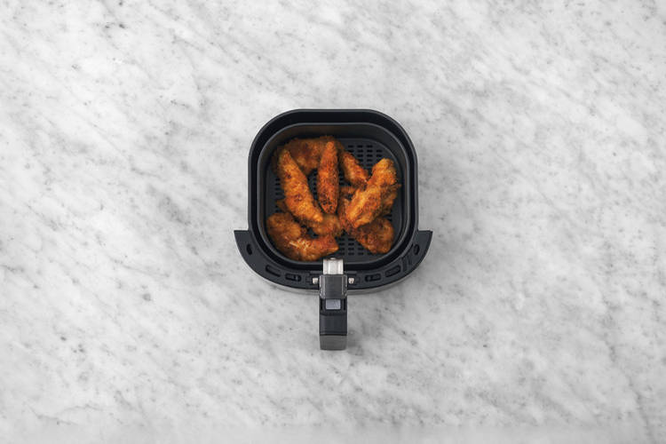 Cook the crumbed prawns