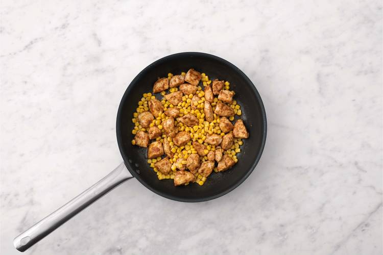 Cook chicken and corn