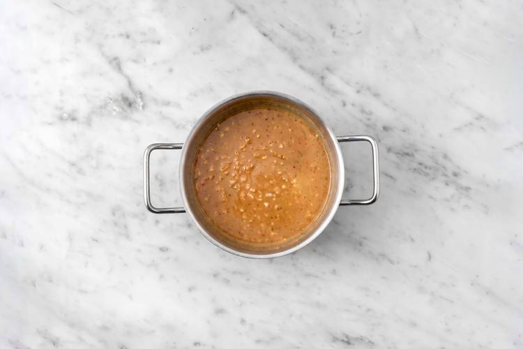Make curry-peanut sauce