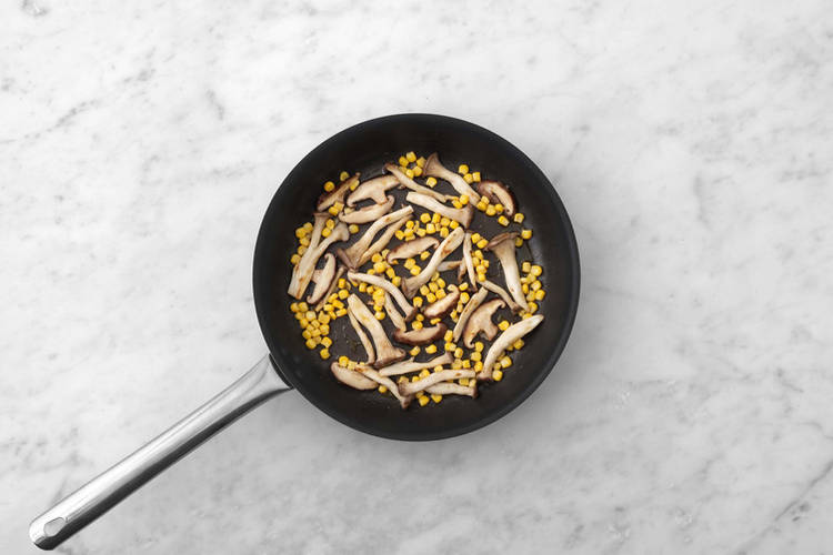 Cook the mushrooms and corn