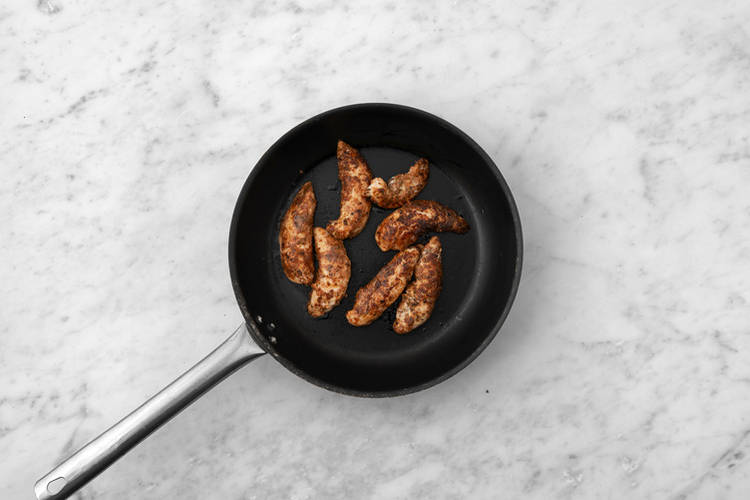 Cook the plant-based crumbed chicken