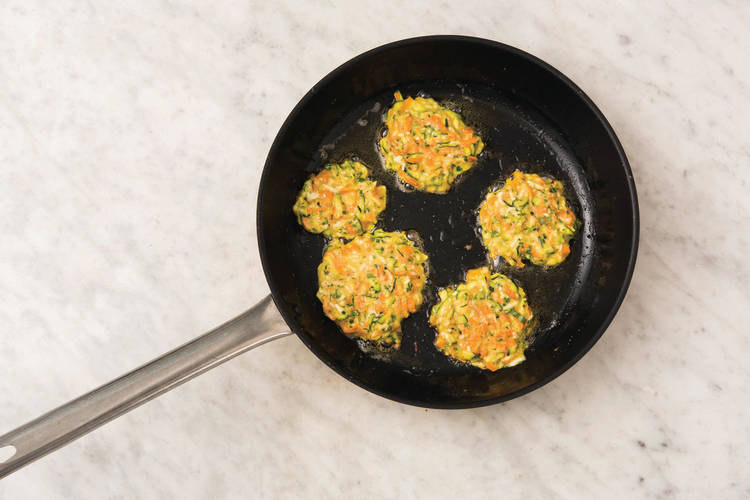 Cook the fritters and salmon