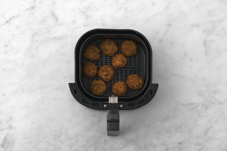 Cook the mozzarella cauliflower bites & prawns