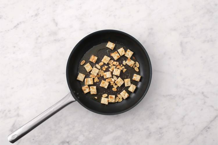 Toast almonds and croutons