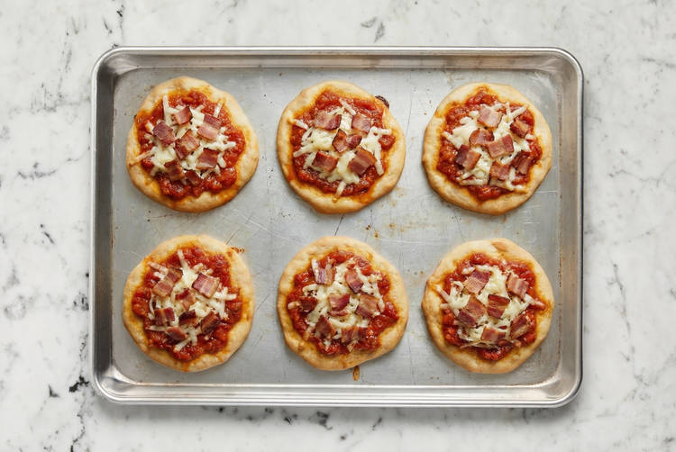 Bake pizza and prep salad