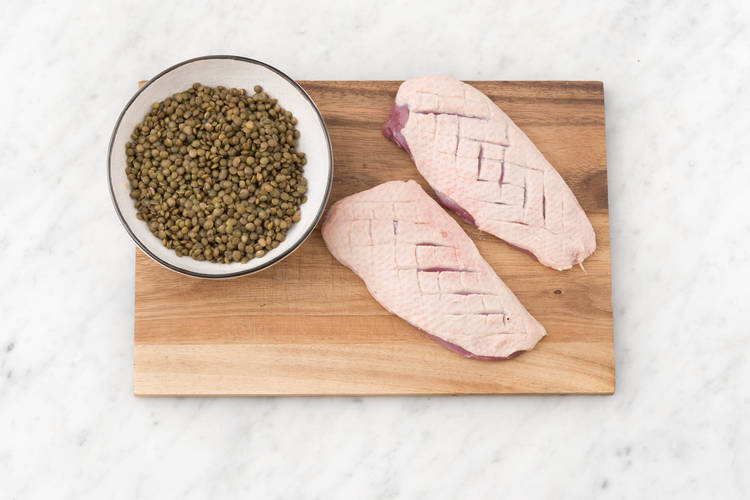 Score the duck breasts