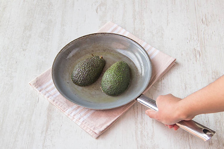 Char the avocado halves