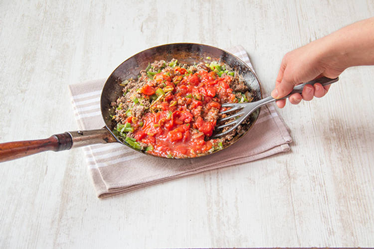 Stir in crushed tomatoes