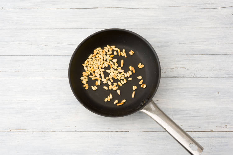 Toast pine nuts.
