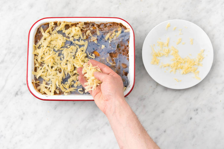 Sprinkle cheese over pie.
