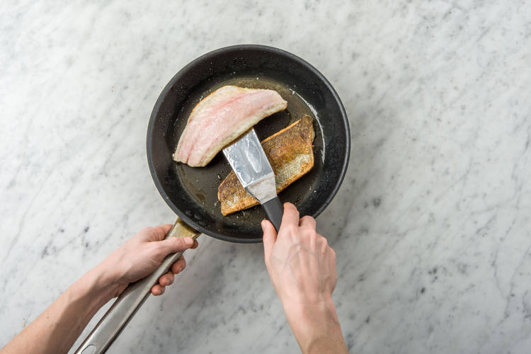Cook fish.